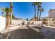 Large backyard with potential for landscaping, patio area, and privacy wall at 8012 Pottery Creek Dr, Las Vegas, NV 89128