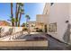 Spacious backyard featuring a covered patio, built-in barbecue, and potential landscaping at 8012 Pottery Creek Dr, Las Vegas, NV 89128