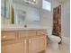 Bathroom features a combination tub and shower with a wooden vanity and a large mirror at 8012 Pottery Creek Dr, Las Vegas, NV 89128