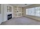 Bright living space with fireplace, and large window offering abundant natural light at 8012 Pottery Creek Dr, Las Vegas, NV 89128