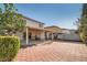 Spacious backyard features a large brick patio and covered area at 8476 Tackle Box Ct, Las Vegas, NV 89113