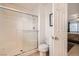 Bathroom with a tiled shower, toilet, and access to the bedroom at 8476 Tackle Box Ct, Las Vegas, NV 89113