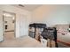 Bedroom with neutral carpet and white walls filled with packing boxes at 8476 Tackle Box Ct, Las Vegas, NV 89113