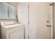 Laundry room with a white dryer, door and window with blinds at 8476 Tackle Box Ct, Las Vegas, NV 89113