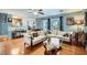 Comfortable living area with hardwood floors, a ceiling fan, and an open layout to the kitchen at 8476 Tackle Box Ct, Las Vegas, NV 89113