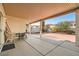 Covered patio with concrete and brick flooring provides a serene outdoor space at 8476 Tackle Box Ct, Las Vegas, NV 89113