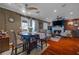 Open-concept dining area features a round table, seating for four, and hardwood flooring at 8600 W Charleston Blvd # 2078, Las Vegas, NV 89117