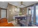 Dining room with a round table, seating for four, and a sliding door to the patio at 8600 W Charleston Blvd # 2078, Las Vegas, NV 89117