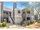 Multi-level apartment building displays a modern exterior with balconies and desert landscaping at 8600 W Charleston Blvd # 2078, Las Vegas, NV 89117
