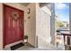 Charming apartment entrance features a red door, decorative wreath, and secure entry system at 8600 W Charleston Blvd # 2078, Las Vegas, NV 89117