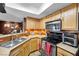 Updated kitchen features stainless steel appliances, granite countertops, and modern fixtures at 8600 W Charleston Blvd # 2078, Las Vegas, NV 89117