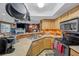 Well-lit kitchen featuring wood cabinets, granite counters, and stainless steel appliances at 8600 W Charleston Blvd # 2078, Las Vegas, NV 89117