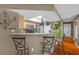Open kitchen featuring modern appliances, a breakfast bar, and a skylight for natural lighting at 8600 W Charleston Blvd # 2078, Las Vegas, NV 89117