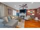 Inviting living room with hardwood floors, comfortable seating, fireplace and a ceiling fan at 8600 W Charleston Blvd # 2078, Las Vegas, NV 89117