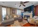 Comfortable living room with fireplace, cozy seating, and a ceiling fan for year-round enjoyment at 8600 W Charleston Blvd # 2078, Las Vegas, NV 89117
