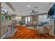 Open living space featuring hardwood floors, a dining area, and a comfortable seating arrangement at 8600 W Charleston Blvd # 2078, Las Vegas, NV 89117