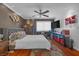 Inviting main bedroom features a ceiling fan, decorative wall art, and natural light at 8600 W Charleston Blvd # 2078, Las Vegas, NV 89117