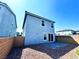 Exterior of home with brick wall, small yard and a patio at 8694 Glen Echo Ave, Las Vegas, NV 89148