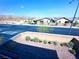 View of the block from the gravel-filled backyard, complemented by lush greenery at 8694 Glen Echo Ave, Las Vegas, NV 89148