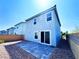Backyard featuring a patio with brick pavers and a landscaped area at 8694 Glen Echo Ave, Las Vegas, NV 89148