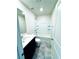 Clean bathroom features tiled floors, a vanity with dark wood cabinets, and a shower-tub combo at 8694 Glen Echo Ave, Las Vegas, NV 89148