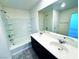 Bathroom featuring dual sinks, a bathtub, and a shower at 8694 Glen Echo Ave, Las Vegas, NV 89148