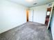 Cozy carpeted bedroom with closet and attached room at 8694 Glen Echo Ave, Las Vegas, NV 89148