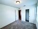 Neutral bedroom with carpet, closet, and natural light at 8694 Glen Echo Ave, Las Vegas, NV 89148