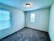 Inviting bedroom featuring carpet, natural light, and neutral decor at 8694 Glen Echo Ave, Las Vegas, NV 89148