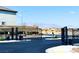 Welcoming community entrance featuring automated black gates, desert landscaping, and distant mountains at 8694 Glen Echo Ave, Las Vegas, NV 89148