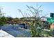 Gated entry to a residential community, featuring lush landscaping and secure access at 8694 Glen Echo Ave, Las Vegas, NV 89148