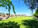 Expansive community park featuring a lush green lawn and meticulously maintained landscaping at 8694 Glen Echo Ave, Las Vegas, NV 89148