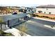 Gated community entrance with well-maintained landscaping and paved streets at 8694 Glen Echo Ave, Las Vegas, NV 89148