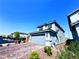 Attractive two-story home with a paved driveway and attached garage at 8694 Glen Echo Ave, Las Vegas, NV 89148