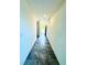Bright hallway features tile floors and a view of the front door at 8694 Glen Echo Ave, Las Vegas, NV 89148