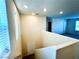 Bright hallway with neutral walls and natural light coming through a window, complemented by carpet flooring at 8694 Glen Echo Ave, Las Vegas, NV 89148