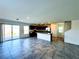 Modern kitchen with granite counters, stainless appliances, island sink, and backyard access at 8694 Glen Echo Ave, Las Vegas, NV 89148