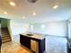 Open-concept living room with tile flooring and a kitchen island at 8694 Glen Echo Ave, Las Vegas, NV 89148