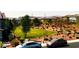 View of a neighborhood park and common area with walking path and small trees at 8694 Glen Echo Ave, Las Vegas, NV 89148