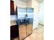 Side by side stainless steel refrigerator with water dispenser in well-lit kitchen area at 8694 Glen Echo Ave, Las Vegas, NV 89148