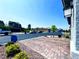 Street view of new home with paved driveway, sidewalk, and manicured landscaping at 8694 Glen Echo Ave, Las Vegas, NV 89148