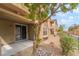 View of the patio and rock landscaping in the backyard at 8942 Partridge Hill St, Las Vegas, NV 89148
