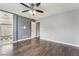 The bedroom provides smooth transition to the bathroom with modern ceiling fan and ample closet space at 8942 Partridge Hill St, Las Vegas, NV 89148