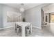 Dining room features modern decor, a pendant light fixture, and a large piece of art on the wall at 8942 Partridge Hill St, Las Vegas, NV 89148