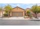Charming single-story home featuring a two-car garage and well-maintained desert landscaping in front at 8942 Partridge Hill St, Las Vegas, NV 89148