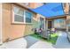 Private outdoor patio area with shade cover, seating, and well-maintained stucco walls at 8942 Partridge Hill St, Las Vegas, NV 89148