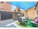 Outdoor patio with charming stucco fireplace, a seating area, and shade at 8942 Partridge Hill St, Las Vegas, NV 89148