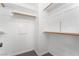 Organized walk-in closet featuring multiple levels of shelving and hanging rods for optimal storage solutions at 8942 Partridge Hill St, Las Vegas, NV 89148