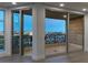 Balcony with sliding glass doors that show decorative iron railing, and city views beyond at 9101 Alta Dr # 207, Las Vegas, NV 89145