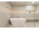 Elegant bathroom features a soaking tub, walk-in shower, and modern fixtures at 9101 Alta Dr # 207, Las Vegas, NV 89145